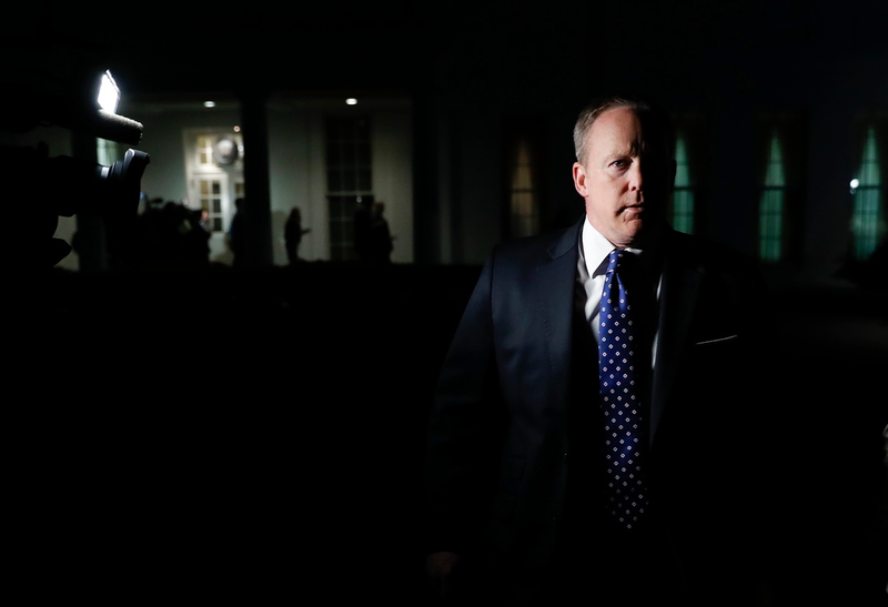 White House press secretary Sean Spicer emerges from “among” the bushes to talk with reporters and insists that the cameras and lights be turned off on May 9, 2017 (AP Photo/Carolyn Kaster)